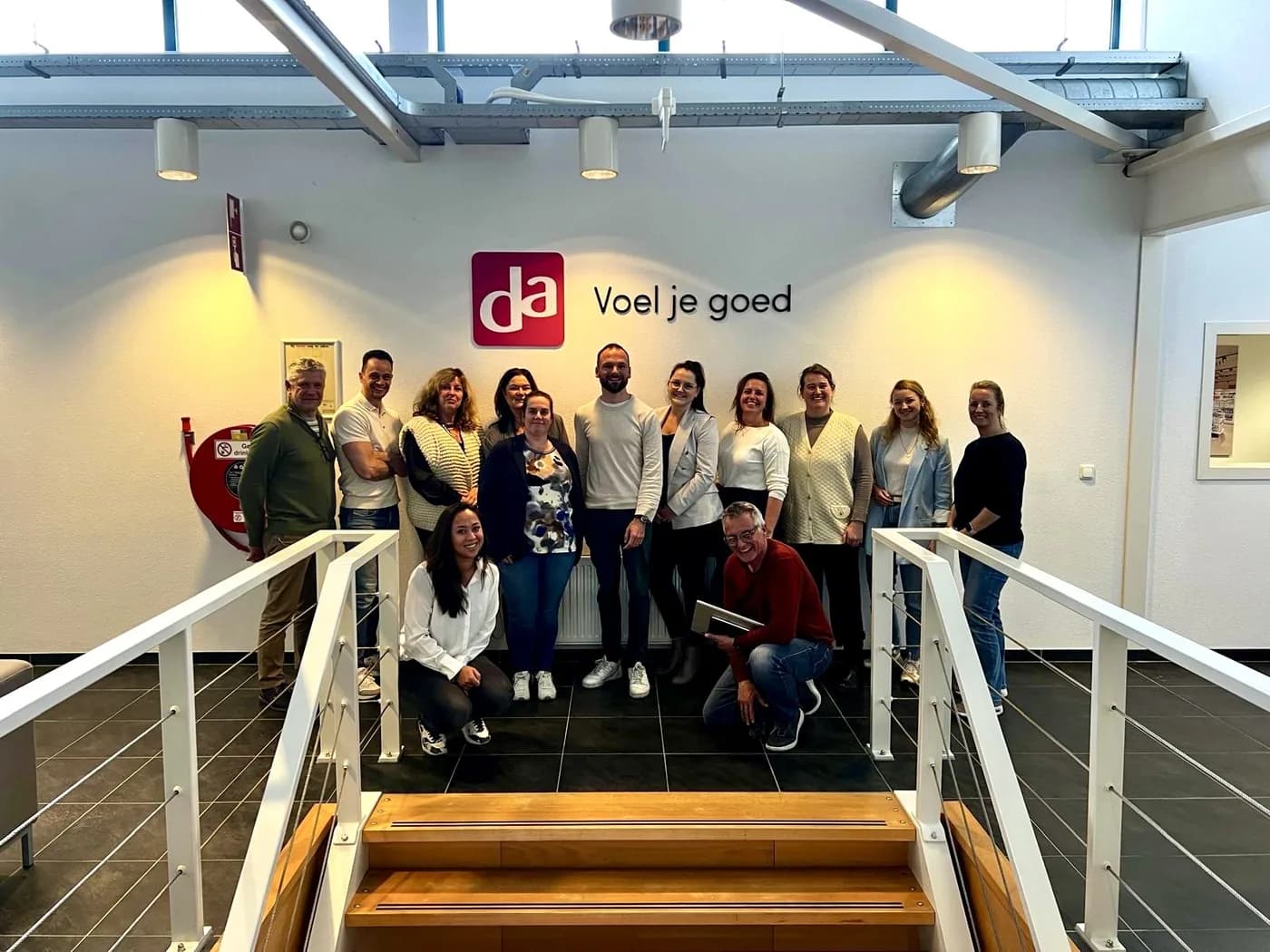 Groepsfoto van een team na een AI-workshop bij DA Drogist